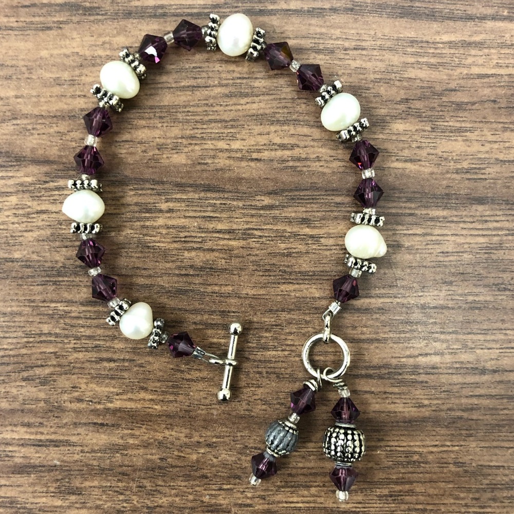 Amethyst colored crystal, pearl, silver bracelet.